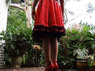 sissy ray outdoors in red dress 2
