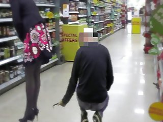 Guy take a video upskirt woman in minimarket
