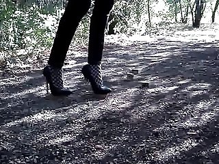 Walking and bending 6 inch silver heels in hoods