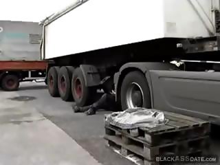 Black prostitute takes on a truck driver trick at the parking lot