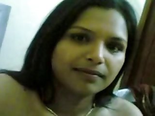 Cute Bangalore housewife with big tits poses naked on cam