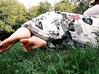 Sandals and barefoot in the grass