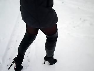 Walk on the snow in high heels in nylon pantyhose